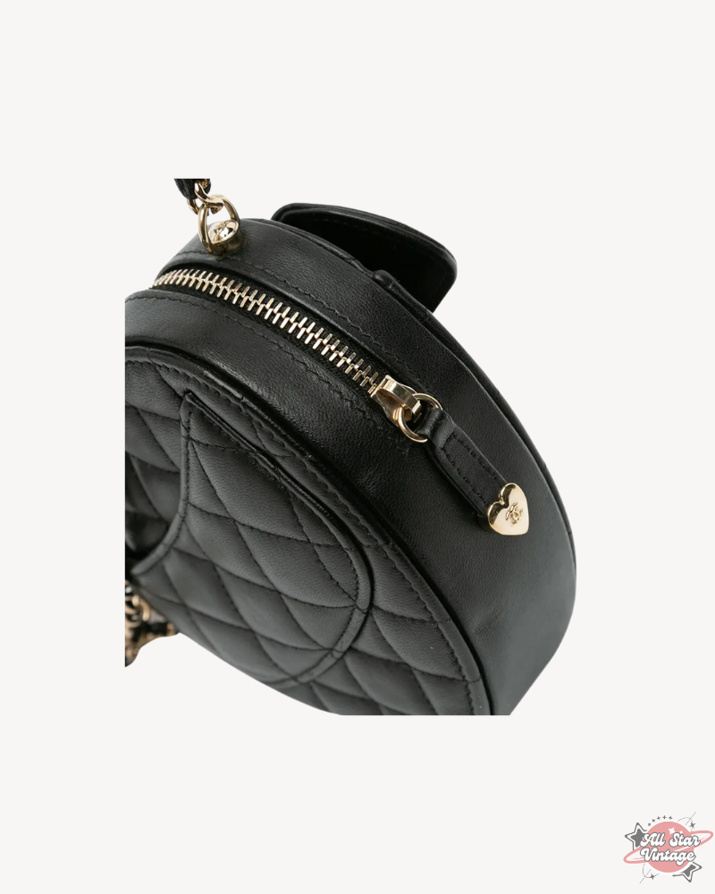 Side view of the Chanel Mini CC In Love Heart Crossbody focusing on the quilted lambskin leather and heart-shaped zipper pull