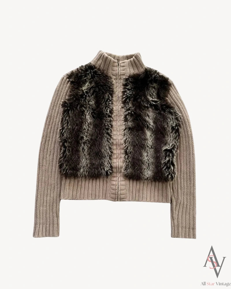 Front view of a taupe ribbed knit cardigan featuring a plush faux fur panel on the front, a high collar, and a zip-up closure for a chic and cozy look