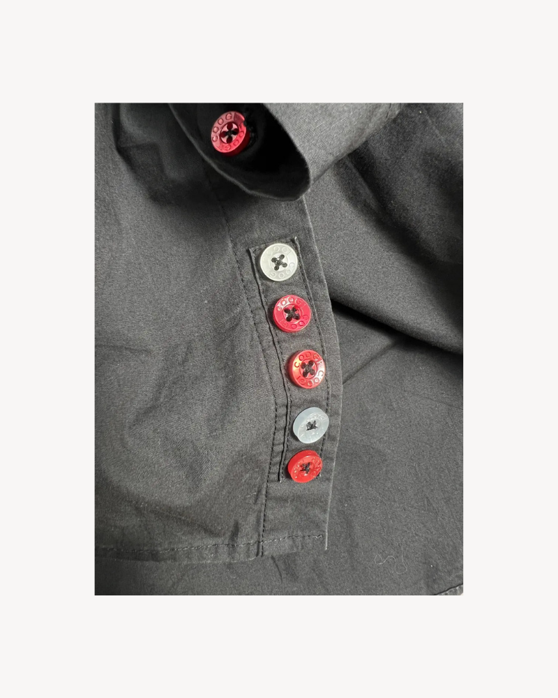 Vintage Coogi Y2K Embroidery Shirt featuring red, white, and black buttons with the ‘Coogi’ logo, emphasizing the unique retro streetwear aesthetic.