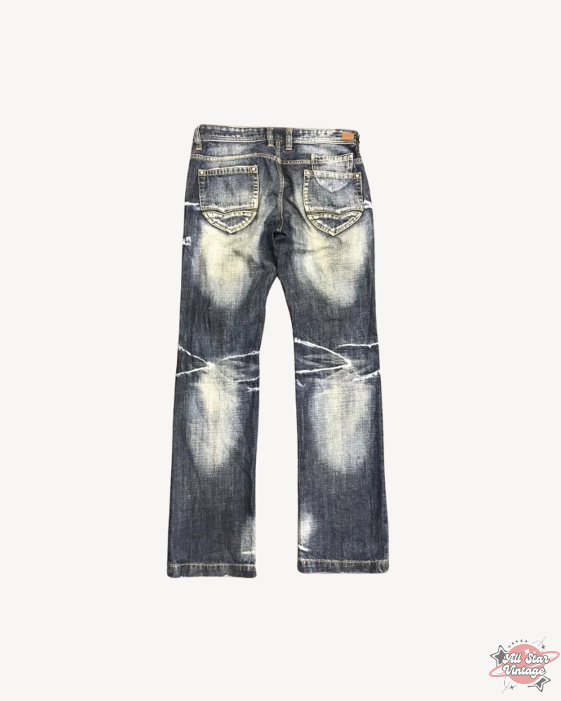 Vintage Flare NCFM Japan Distressed Faded Jeans showcasing a worn-in, distressed design with bold style elements, perfect for adding an edgy touch to streetwear outfits.