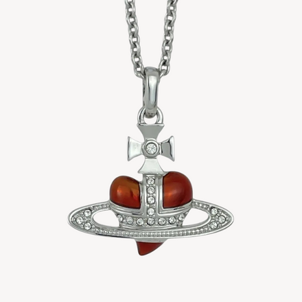 Vivienne Westwood Crystal Heart Orb Necklace featuring a red heart and silver orb design with embedded crystals. A timeless luxury accessory for romantic and elegant styles.