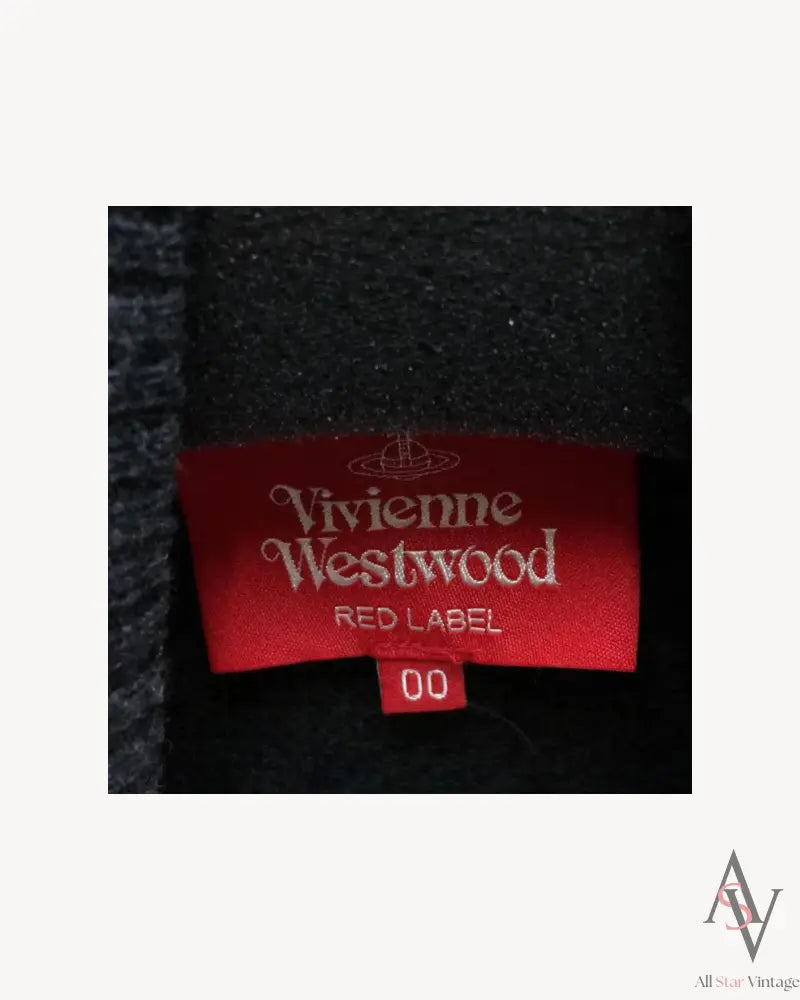 Close-up of a Vivienne Westwood Red Label knit sweater tag, featuring the designer's iconic logo on a red fabric label with the size "00."