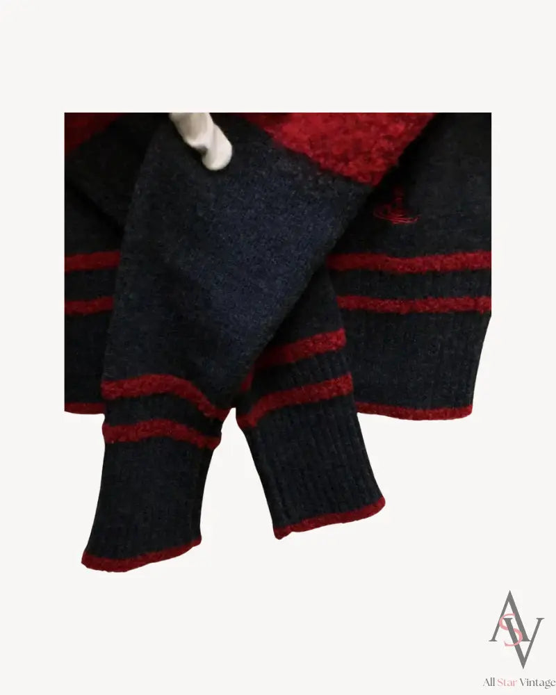 Detailed shot of the cuffs of a Vivienne Westwood Red Label sweater, showcasing a navy and red striped knit design with ribbed edges